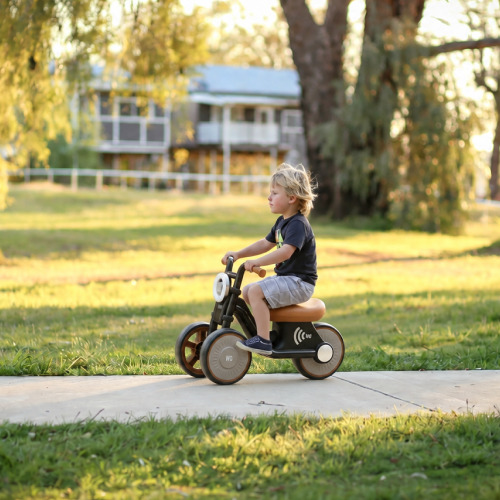 The Tiny Biker ride-on motorcycle in Knight Black, side view